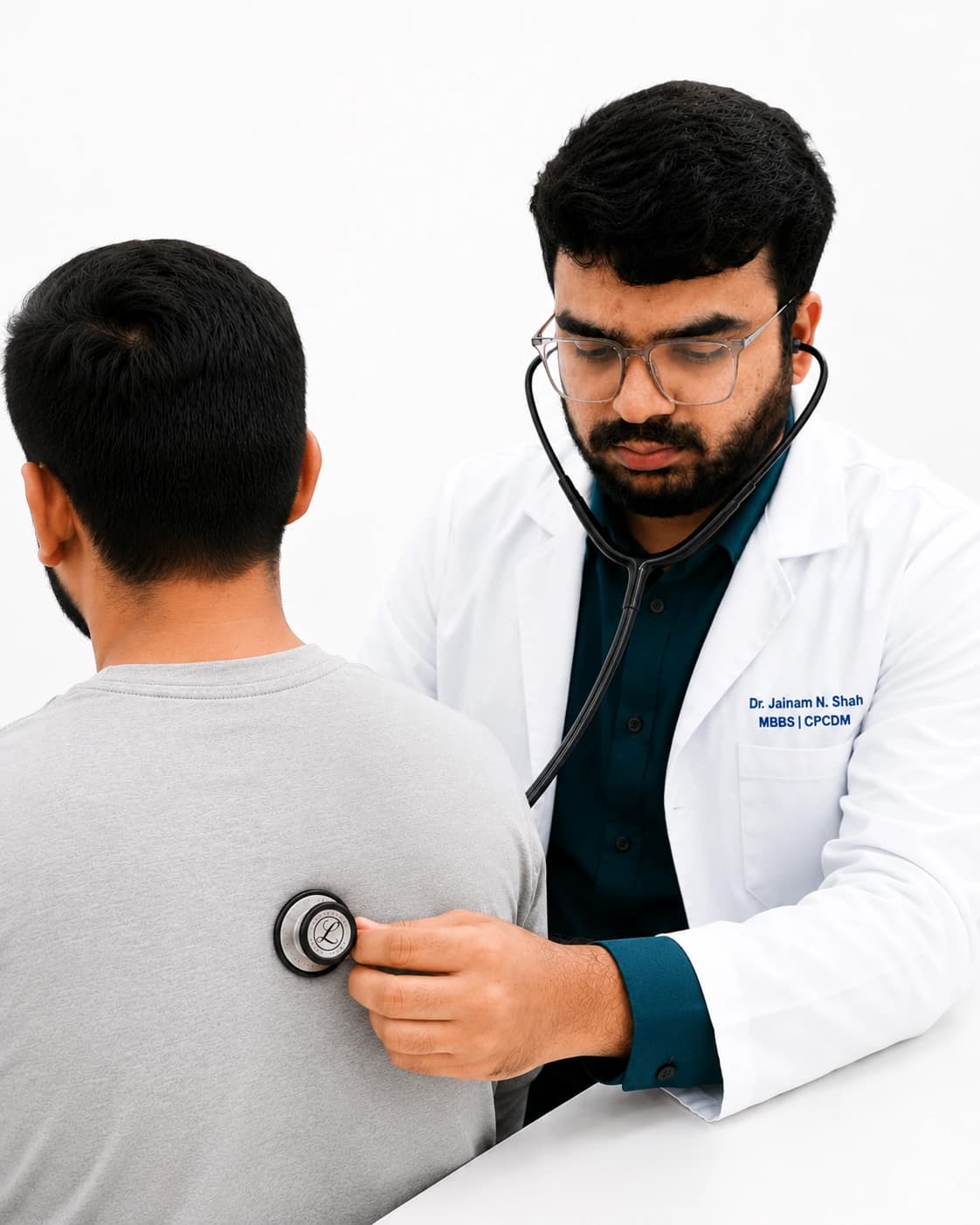 Dr. Jainam N. Shah examining a patient